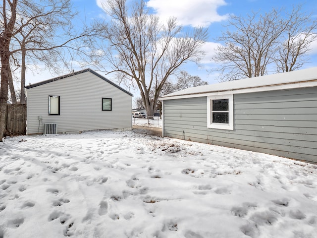 exterior space with a garage and fence