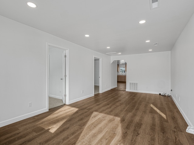 unfurnished living room featuring visible vents, wood finished floors, and recessed lighting