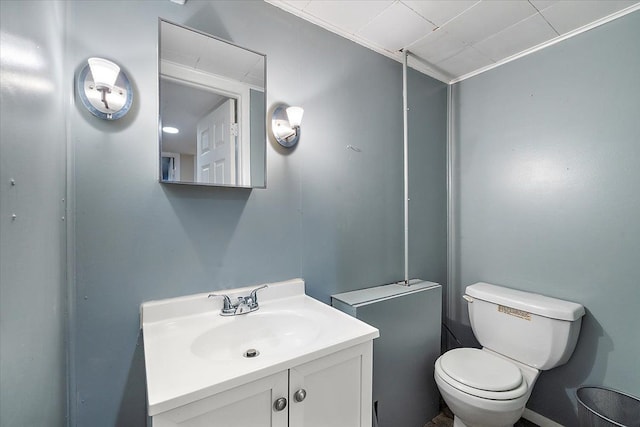 bathroom featuring toilet and vanity