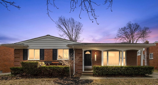 ranch-style home with brick siding