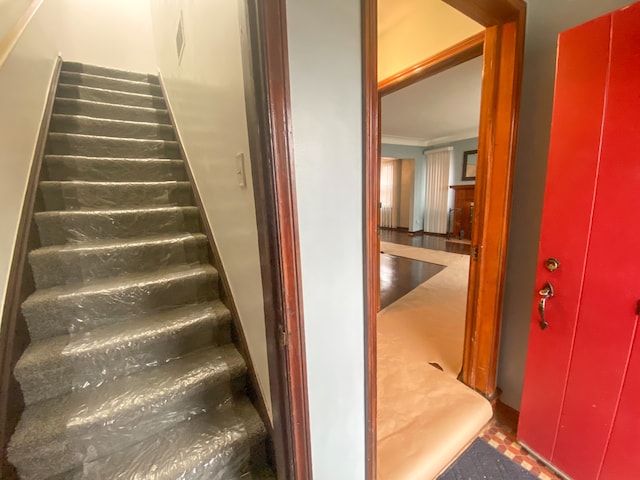 staircase with crown molding