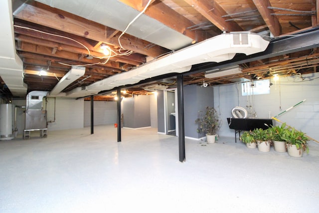 basement featuring heating unit and gas water heater