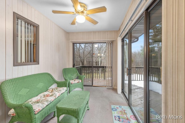 sunroom featuring a ceiling fan