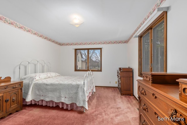 bedroom featuring light colored carpet