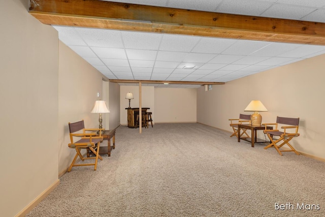 sitting room featuring a paneled ceiling, carpet flooring, and baseboards