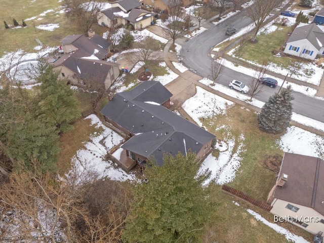 snowy aerial view with a residential view