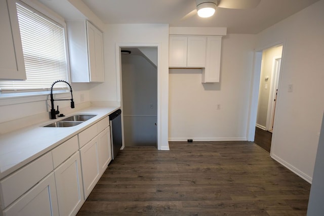 kitchen featuring a sink, dark wood-style floors, white cabinetry, and dishwasher