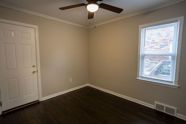 unfurnished room featuring crown molding, dark wood finished floors, visible vents, ceiling fan, and baseboards