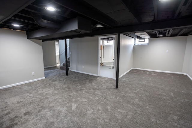 basement featuring carpet floors and baseboards