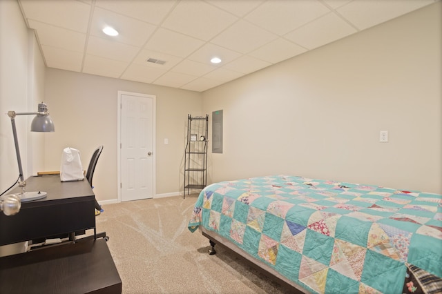 bedroom with electric panel, baseboards, visible vents, a drop ceiling, and carpet flooring