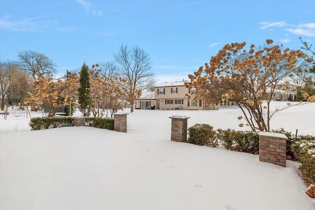 view of yard layered in snow