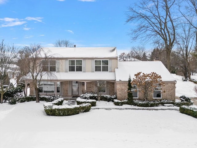 view of front of property featuring brick siding