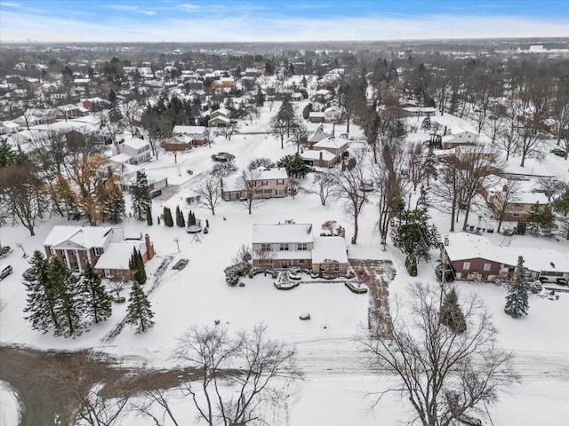 snowy aerial view featuring a residential view