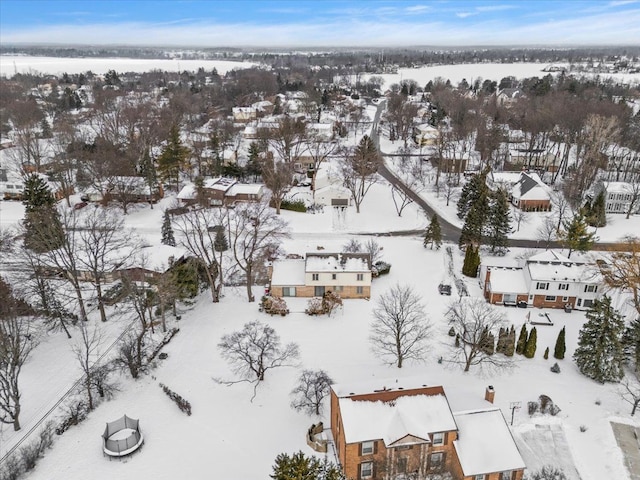 snowy aerial view with a residential view