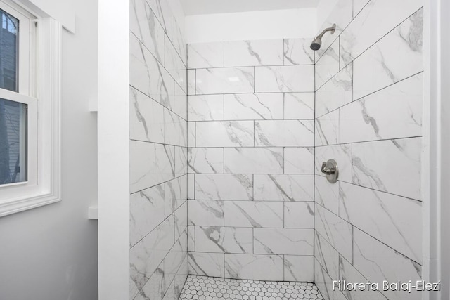 full bath featuring tiled shower