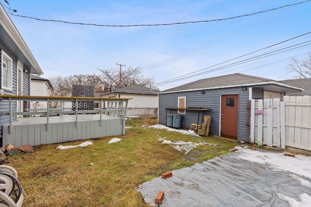 view of yard with fence and a wooden deck