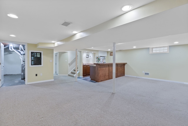 basement featuring light carpet, recessed lighting, and baseboards