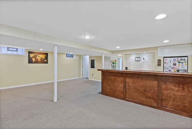 interior space featuring baseboards, fridge, recessed lighting, and light colored carpet