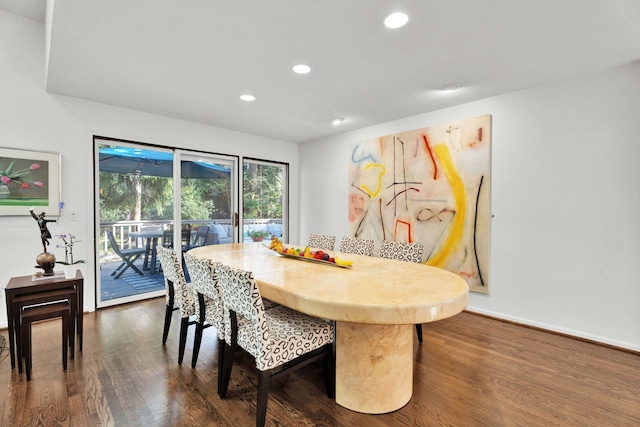 dining area featuring dark wood-style floors, baseboards, and recessed lighting