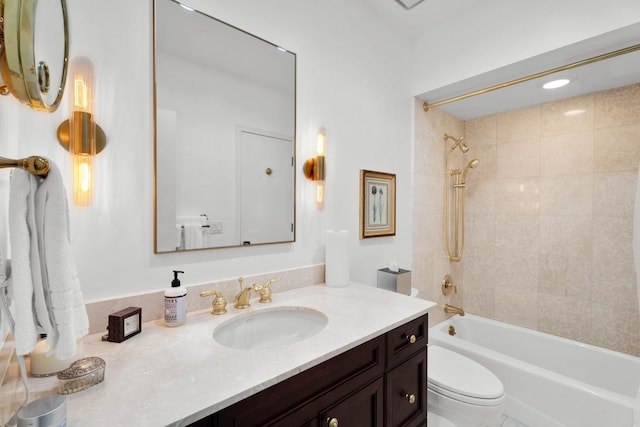 bathroom featuring shower / bathing tub combination, vanity, and toilet