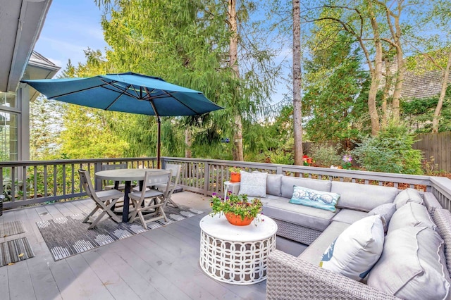 deck with fence, an outdoor living space, and outdoor dining space