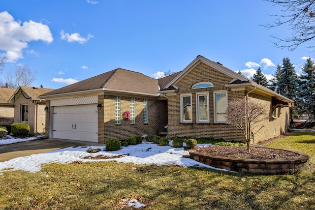 view of front of property featuring an attached garage, brick siding, a shingled roof, a yard, and driveway