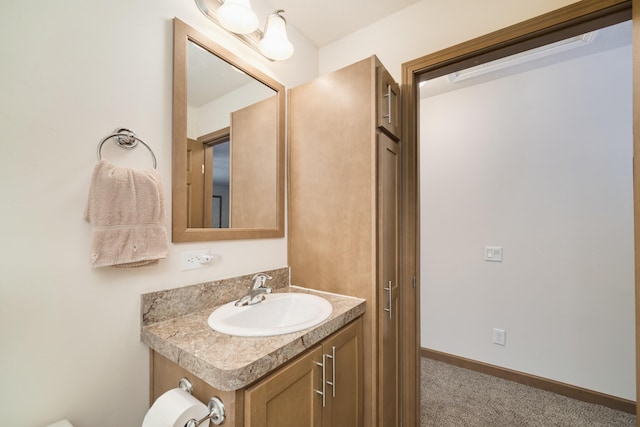 bathroom featuring vanity and baseboards