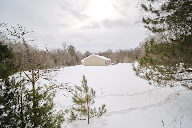 view of yard layered in snow