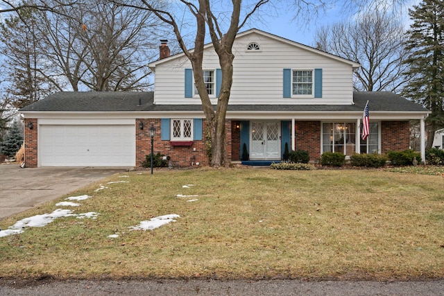 traditional-style home with a garage, brick siding, driveway, a front lawn, and a chimney