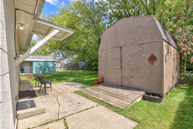 view of shed featuring fence