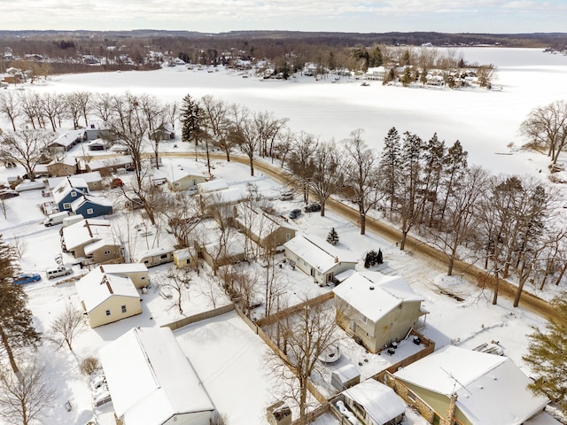 snowy aerial view with a residential view