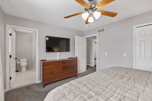 bedroom featuring connected bathroom, carpet flooring, visible vents, a ceiling fan, and a closet