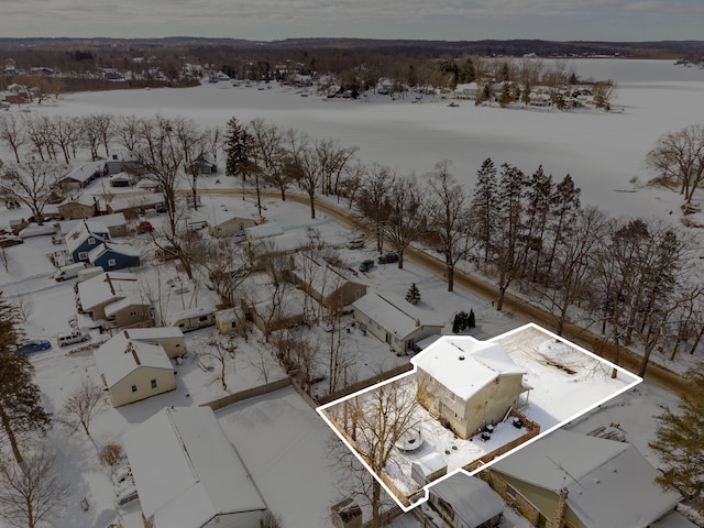 snowy aerial view featuring a residential view