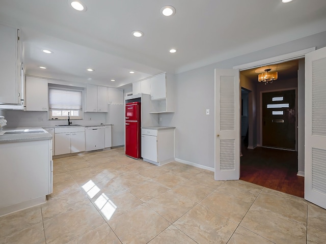 kitchen with light tile patterned floors, white dishwasher, recessed lighting, white cabinetry, and light countertops