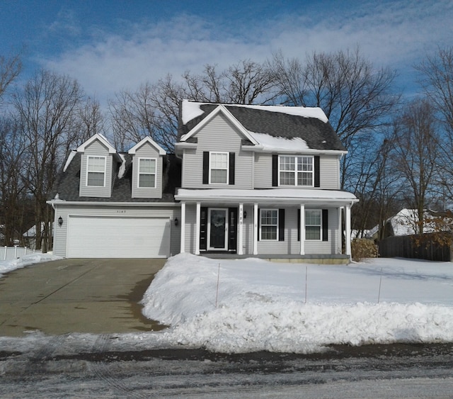 view of front of home featuring driveway and a porch