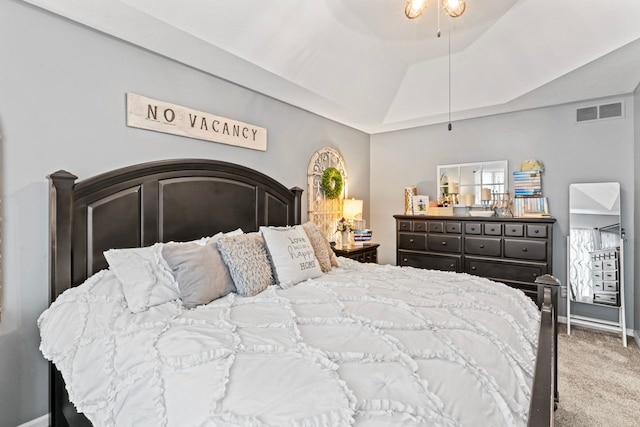 carpeted bedroom with lofted ceiling, a ceiling fan, visible vents, and baseboards