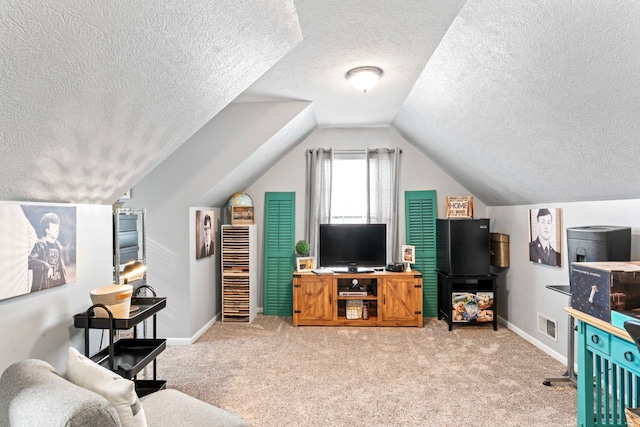 living room with lofted ceiling, light carpet, visible vents, and baseboards