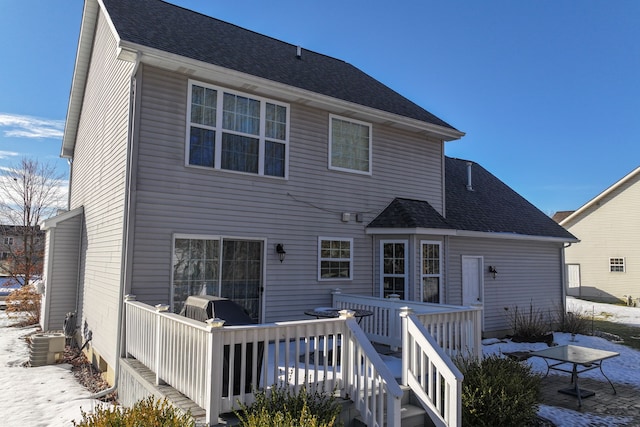 back of property featuring roof with shingles, a wooden deck, and central air condition unit