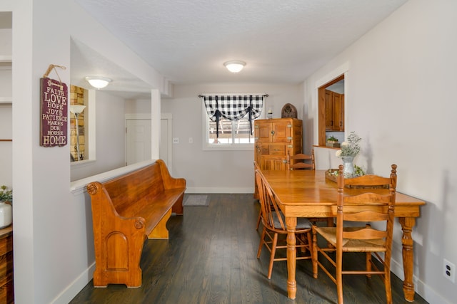 7214 S M 66, Mancelona, MI 49659 - dining area with baseboards, wood finished floors, and a textured ceiling