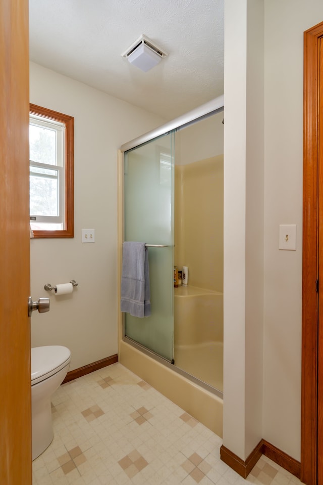 7214 S M 66, Mancelona, MI 49659 - bathroom featuring a shower stall, tile patterned floors, visible vents, and toilet