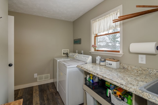 7214 S M 66, Mancelona, MI 49659 - washroom featuring visible vents, baseboards, laundry area, dark wood-type flooring, and washing machine and dryer