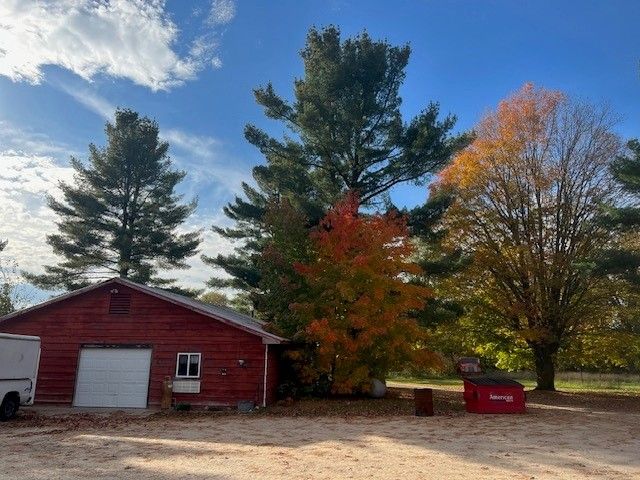7214 S M 66, Mancelona, MI 49659 - view of side of home with an outbuilding