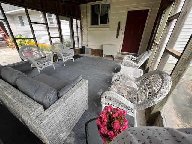 7214 S M 66, Mancelona, MI 49659 - sunroom / solarium featuring an outdoor living space