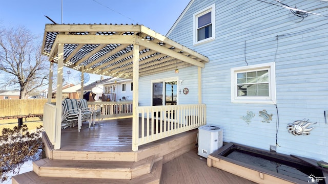 deck with fence and a pergola