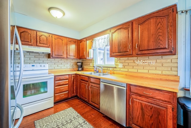 kitchen featuring white electric range, backsplash, a sink, dishwasher, and under cabinet range hood