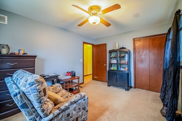 interior space with light carpet, ceiling fan, and baseboards