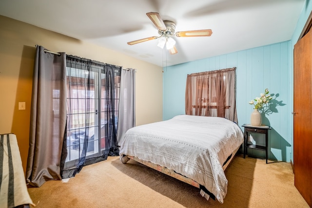 bedroom featuring light carpet and ceiling fan