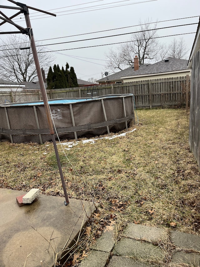 view of yard with a fenced backyard and a fenced in pool