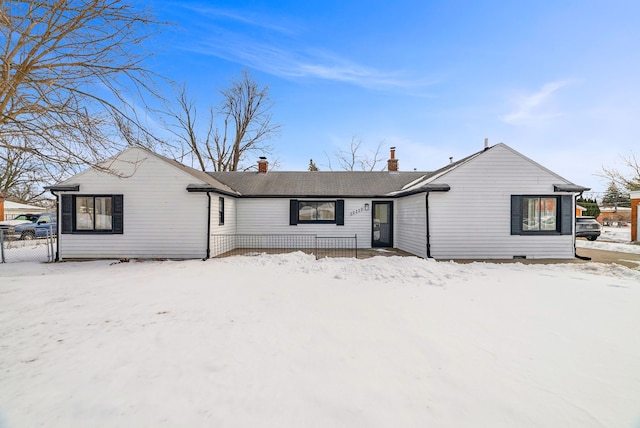 single story home featuring a chimney and fence