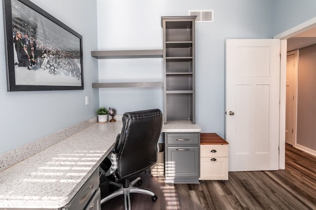 office space with dark wood-type flooring and visible vents